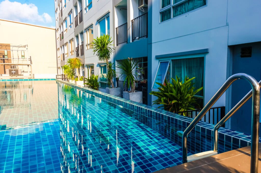luxury smimming pool inside of low rise condominium building